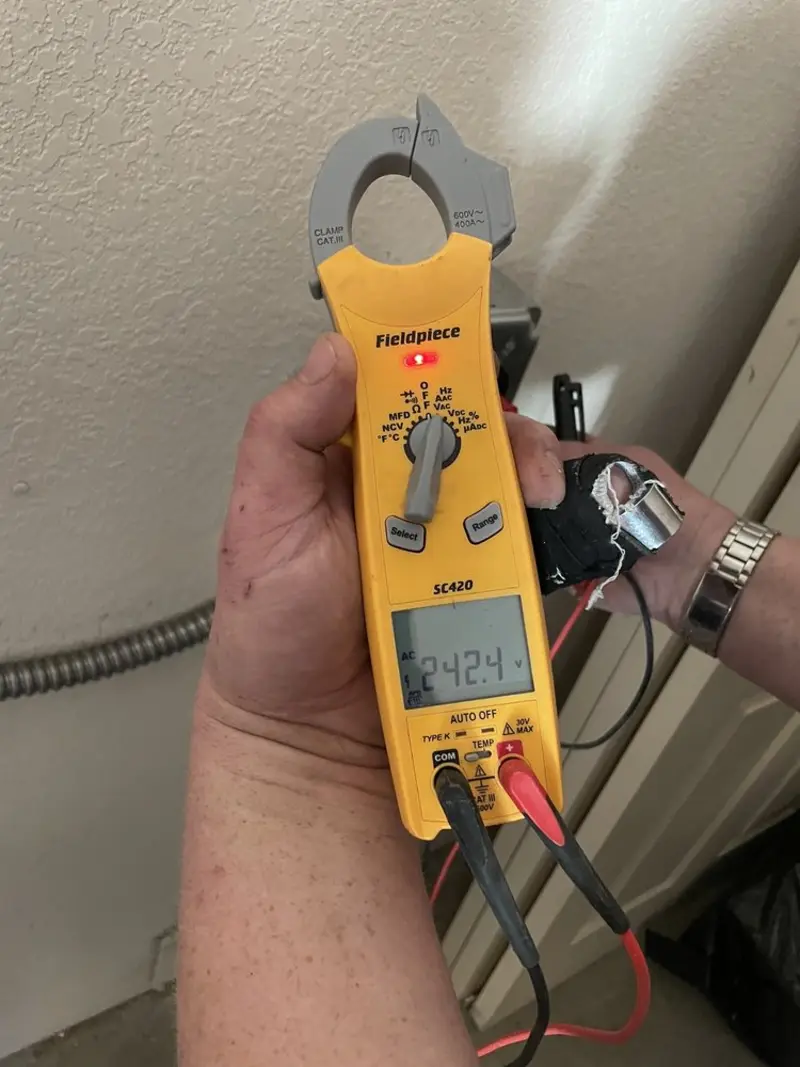 Voltage testing with clamp meter during Outlet Installation in Litchfield